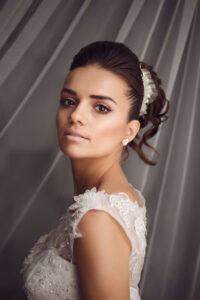 Beauty portrait of young bride. Perfect makeup and hairstyle.